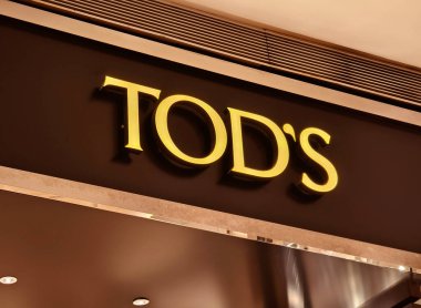 KUALA LUMPUR, MALAYSIA - AUGUST 28, 2024: Tods brand retail shop in the large shopping mall. clipart