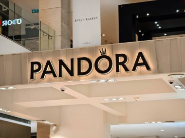 KUALA LUMPUR, MALAYSIA - AUGUST 28, 2024: Pandora brand retail shop in the large shopping mall. clipart