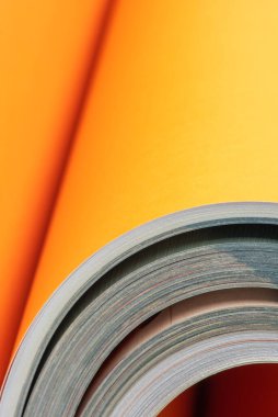 Opened book with rolled up pages close-up