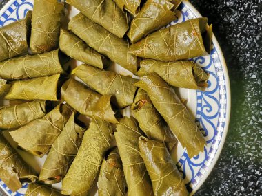 Şarap yaprağı lezzetli yemek arkaplanı olarak yuvarlanır