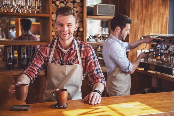 Handsome Young Waiter Holding Cup Hot Drink Looking Camera Smiling — Stock Photo, Image