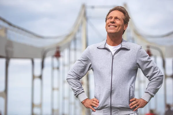 Handsome Middle Aged Man Sports Uniform Looking Upward Smiling Sun — Stock Photo, Image