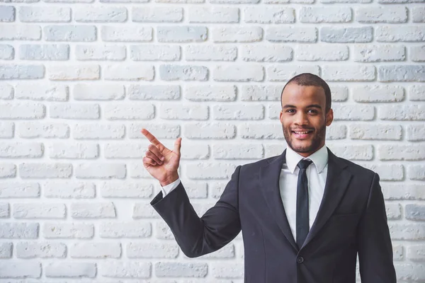 Handsome Afro American Businessman Classic Suit Pointing Away Looking Camera — Stock Photo, Image