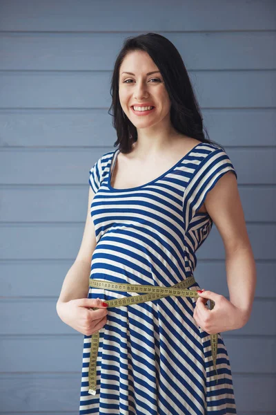 Beautiful Pregnant Woman Measuring Her Belly Using Tape Measure Looking — Stock Photo, Image
