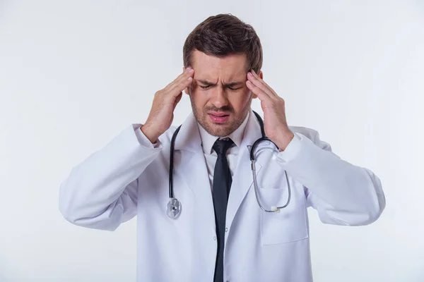 Portrait Handsome Tired Doctor White Coat Massaging His Temples Isolated — Stock Photo, Image