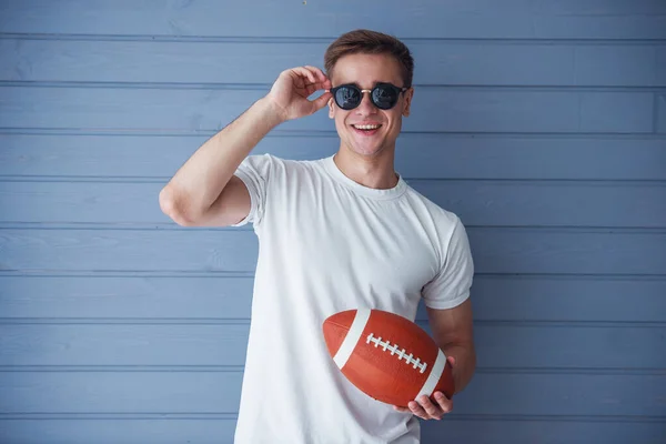 Handsome Young Man Casual Clothes Sun Glasses Holding American Football — Stock Photo, Image