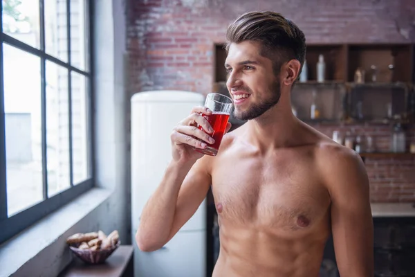 Sexy Young Man Bare Torso Drinking Juice Looking Out Window — Stock Photo, Image