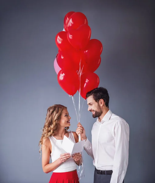 Handsome Elegant Guy Presenting Gift Card Balloons His Beautiful Girlfriend — Stock Photo, Image