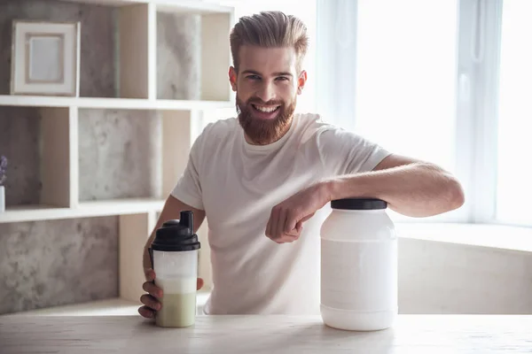 Handsome Young Bearded Sportsman Looking Camera Smiling While Preparing Sport — Stock Photo, Image