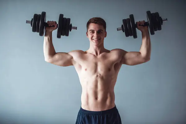Handsome Muscular Guy Bare Torso Holding Dumbbells Looking Camera Smiling — Stock Photo, Image