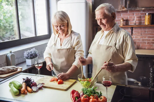 Beautiful Senior Couple Aprons Talking Smiling While Cooking Together Kitchen — Stock Photo, Image