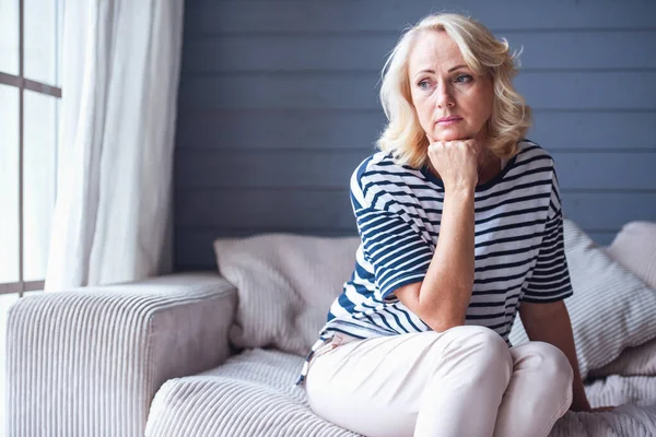 Beautiful Sad Senior Woman Leaning Her Hand Looking Downward While — Stock Photo, Image