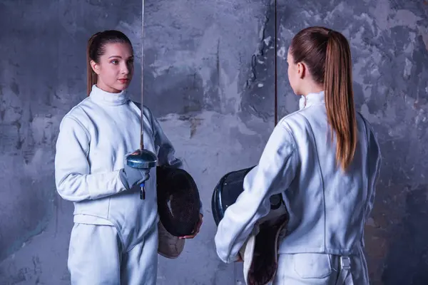 Beautiful Female Fencers Protective Clothing Holding Masks Weapon Looking Each — Stock Photo, Image