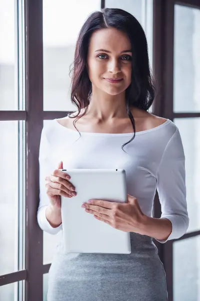 Attractive Young Woman Holding Digital Tablet Looking Camera Smiling While — Stock Photo, Image