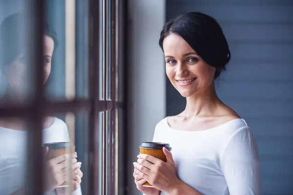Attractive Young Woman Holding Cup Coffee Looking Camera Smiling While — Stock Photo, Image