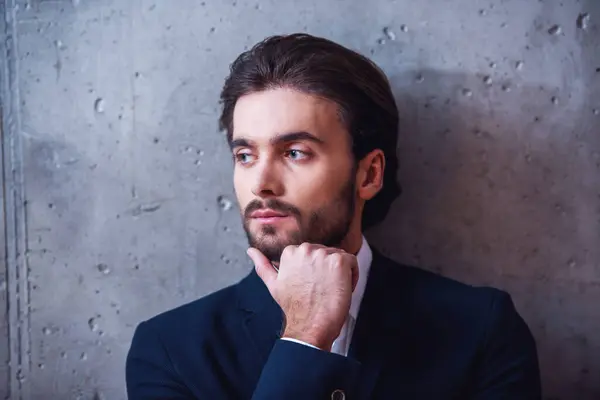 Handsome Confident Businessman Bristle Suit Touching His Chin Looking Away — Stock Photo, Image