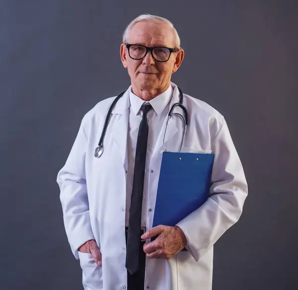 Handsome Old Doctor Medical Coat Eyeglasses Holding Folder Looking Camera — Stock Photo, Image