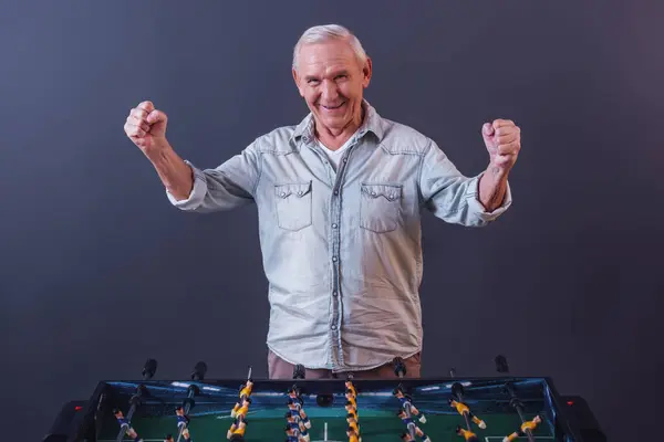 Handsome Old Man Casual Clothes Playing Table Football Looking Camera — Stock Photo, Image