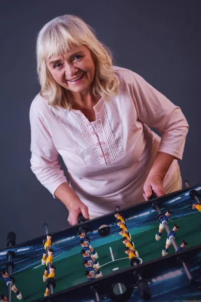 Beautiful Old Woman Casual Clothes Playing Table Football Looking Camera — Stock Photo, Image