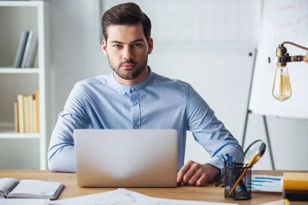 Handsome Businessman Looking Camera While Working Laptop Office Royalty Free Stock Images