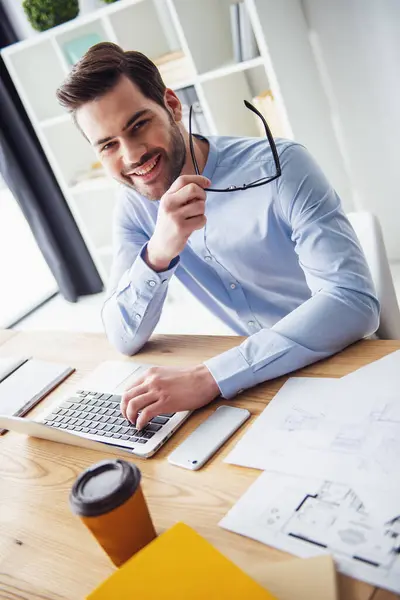 Handsome Businessman Holding Glasses Looking Camera Smiling While Working Laptop Stock Picture