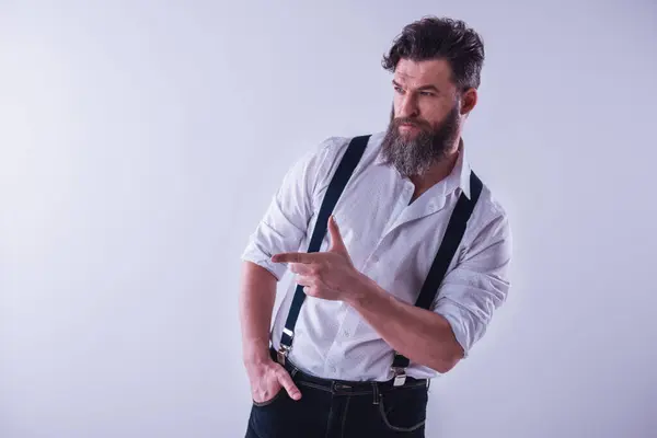 Style Bearded Man Shirt Suspenders Pointing Side Light Background Stock Photo