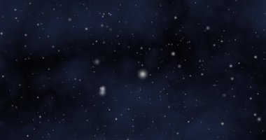 Falling snow against the background of the night sky. High quality 4k footage