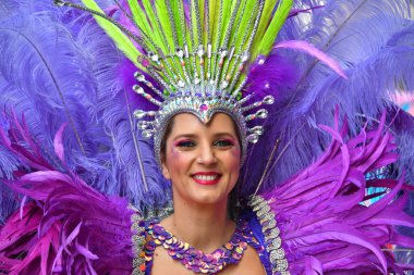 TORREVIEJA, SPAIN  FEBRUARY 12, 2023 Participants dressed in a colorful carnival costumes on the street during the traditional Mardi Gras parade in Spai