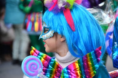 TORREVIEJA, SPAIN  FEBRUARY 12, 2023 Close up portrait of a girl in a colorful carnival costume at a festive parade, Alicante, Costa blanca region. Spai
