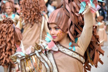 TORREVIEJA, SPAIN FEBRUARY 12, 2023: Kids in a colorful carnival costumes at a festive parade, Alicante, Costa blanca region. Spain