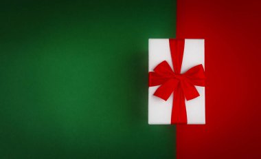 Kırmızı hediye kutusu yeşil ve kırmızı Noel arkaplanlı..