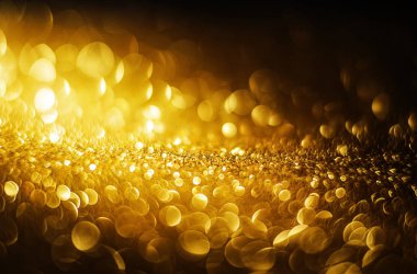 Altın soyut bokeh ışıkları. Odaklanmamış arkaplan.