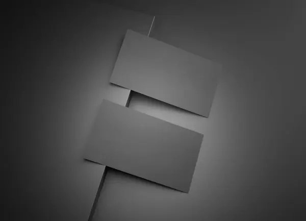 Two black business card Mockup. Textured calling card template on a dark squared surface. 3D rendering