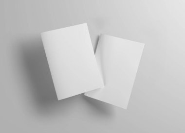 Beyaz arka planda gölgeli iki yüzen dergi kapağı. 3B görüntüleme