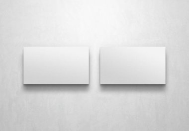 Beyaz arka planda izole edilmiş iki Minimalist kartvizit. 3B görüntüleme