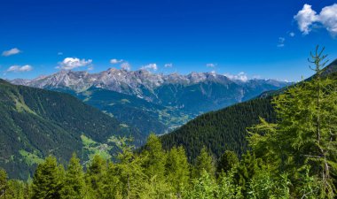 Summer landscape in mountains and blue sky with clouds. Location place Alps, Tyrol, Austria, Europe.