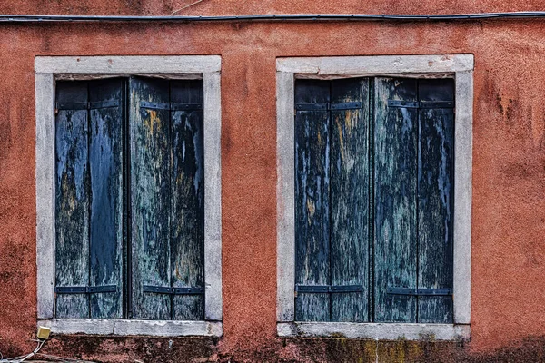 Blue Window Covers Orange Walls — Photo