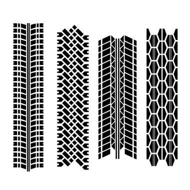 Farklı lastik izleri ve mürekkep lekeleri olan siyah, katı bir arka plan.