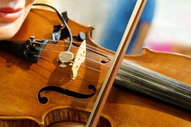 Close-up view of girl playing violin,practicing or training or hobby                               