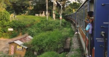 Sri Lanka train ride through mountain rainforests and railway tunnels. High-quality slow motion 4k footage