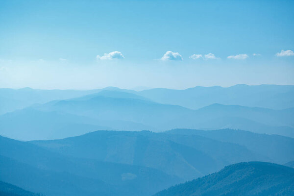 Layers of ridges in Carpathians Mountains Ukraine at sanrise sky
