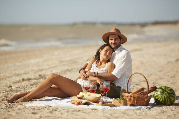 Couple Enjoys Romantic Picnic Sunny Beach Surrounded Food Wine Basking Stock Picture