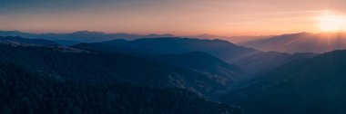 Stunning panoramic view of the Carpathian Mountains at sunrise, capturing the serene beauty of the mountain ridges. Perfect for travel promotions, nature blogs, and landscape enthusiasts. clipart