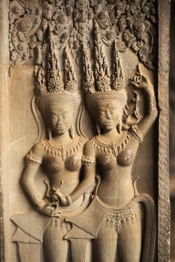 Kamboçya 'daki Angkor Wat Tapınağı' ndaki antik Khmer apsara taş yardım oymaları, tarih, kültür, maneviyat, arkeoloji, sanat, mimari, turizm ve dünya mirası konsepti.