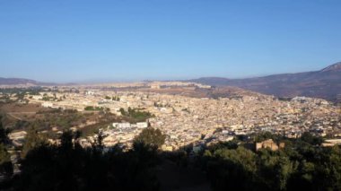 View of the old town of Fez (Fes), Fes el Bali and Fes el Jdid, Morocco. Famous touristic travel destination and UNESCO World Heritage site. 4k, establishing shot.