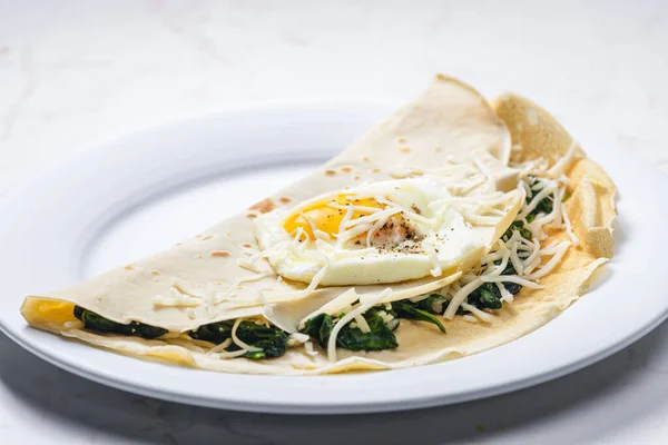 Pancake Stuffed Spinach Leaves Served Fried Egg Grated Cheese — Stock Photo, Image