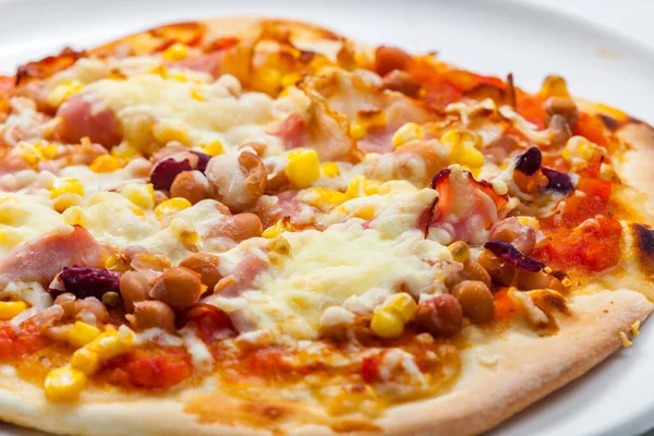homemade pizza with bacon, corn and beans
