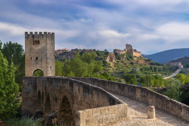 stone bridge over Ebro river in Frias, Burgos province, Castilla Leon, Spain