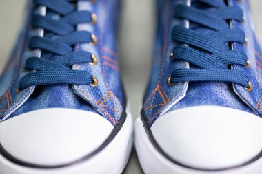 close up of denim sneakers