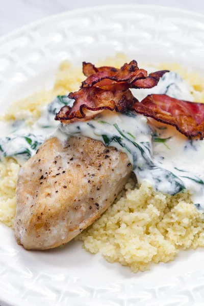 Poultry Breast Spinach Creamy Sauce Bacon Served Couscous — Fotografie, imagine de stoc